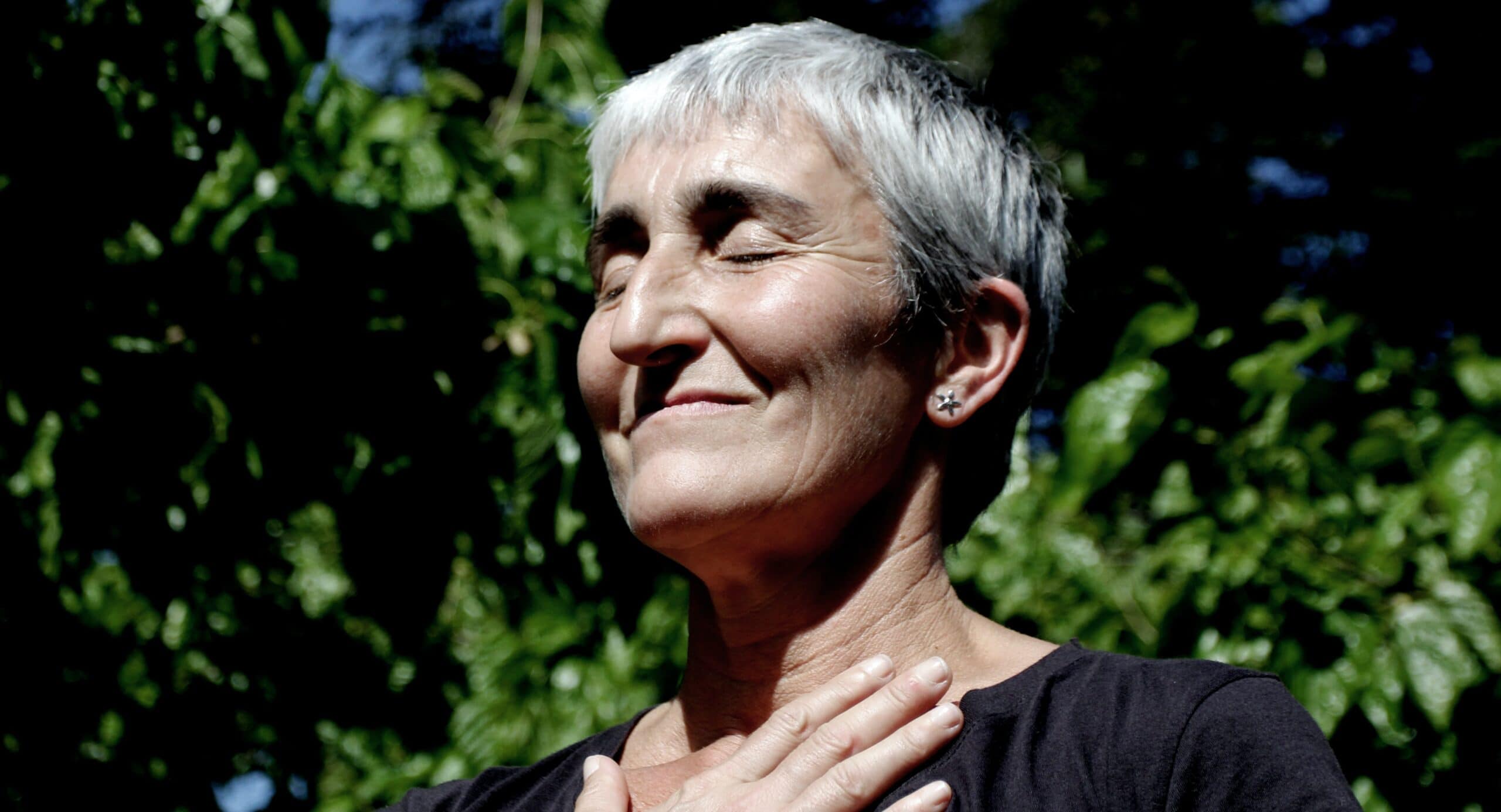 woman and black shirt closing her eyes