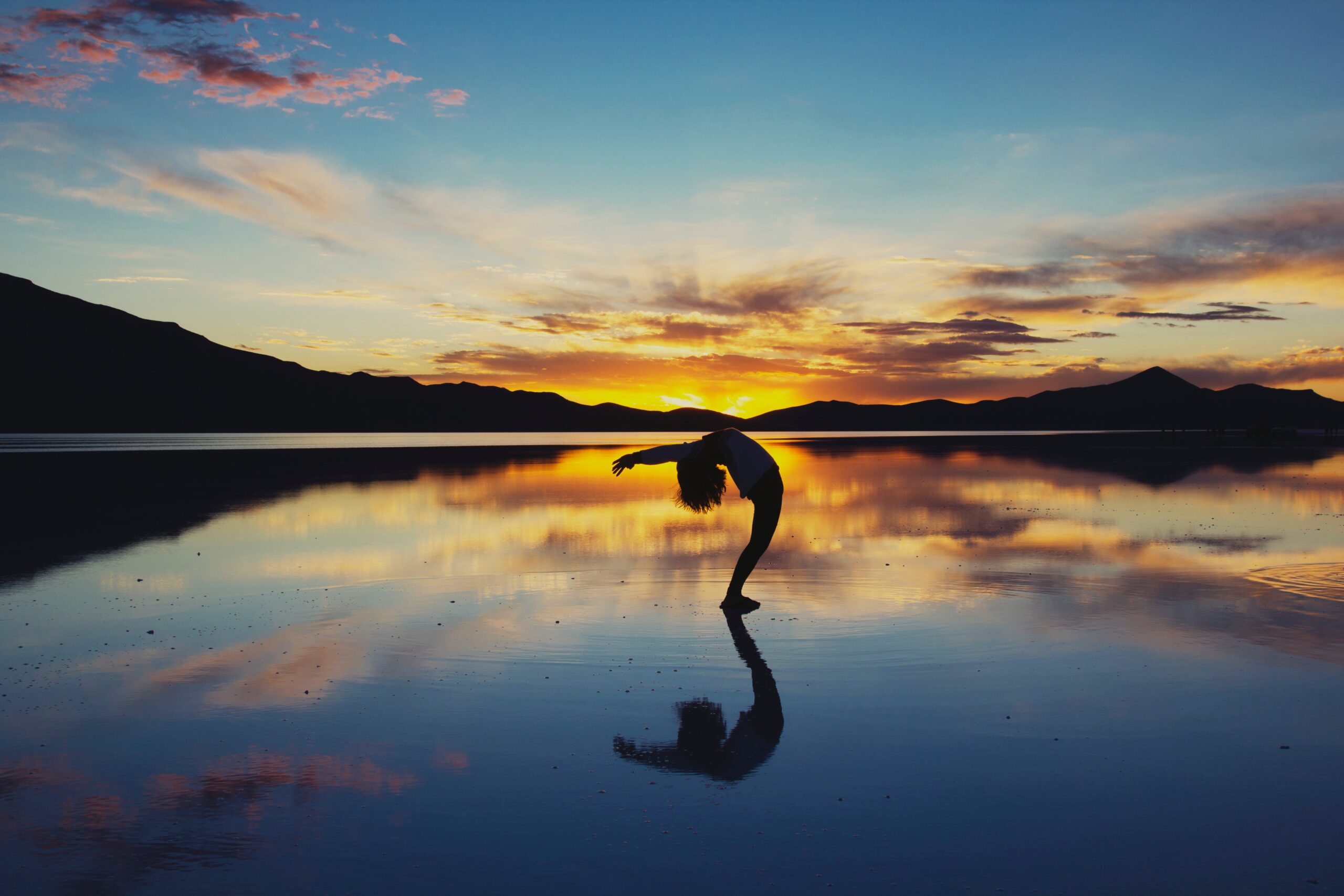 silhouette photography of woman doing yoga